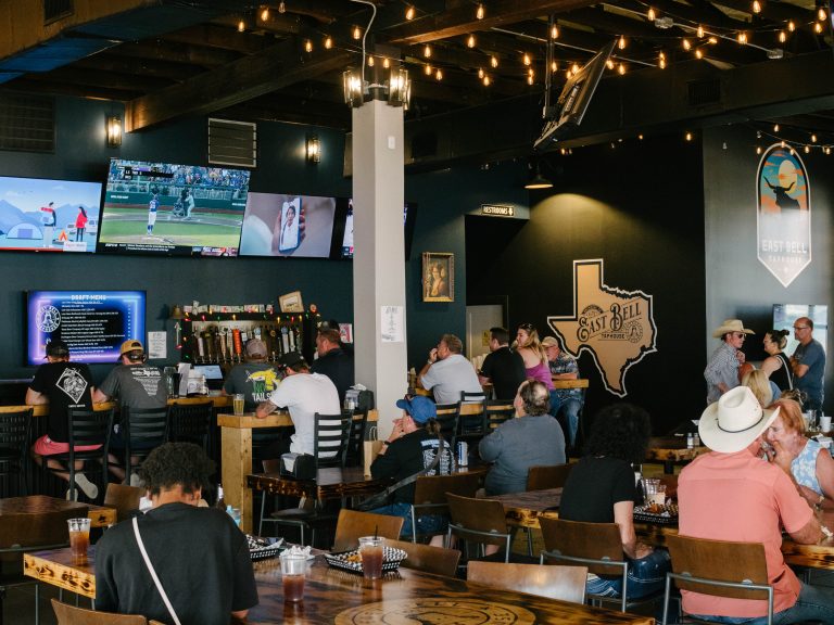Sports bar and pizza place in Rockdale, Texas with locals enjoying.